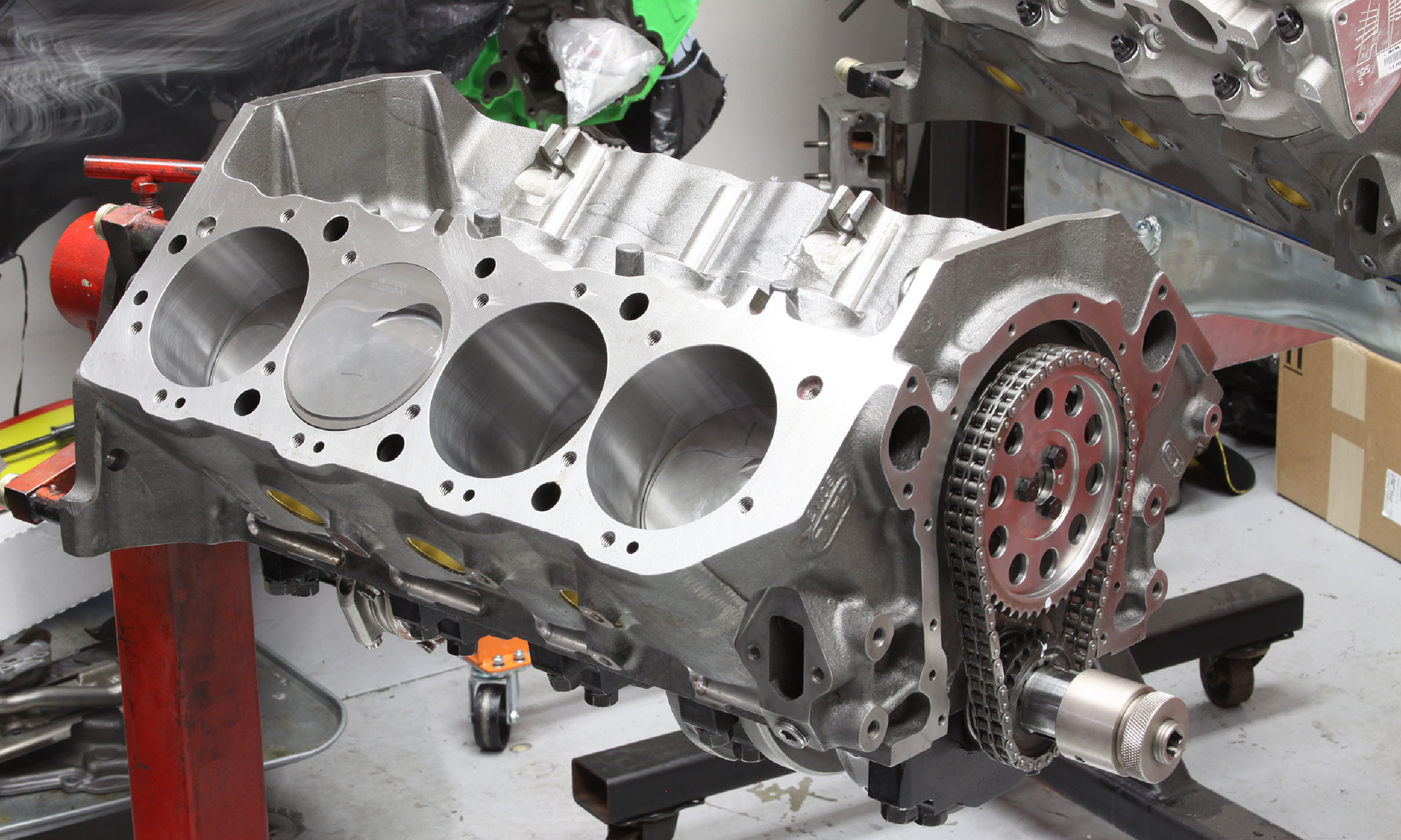 Technician inspecting underbody on lift